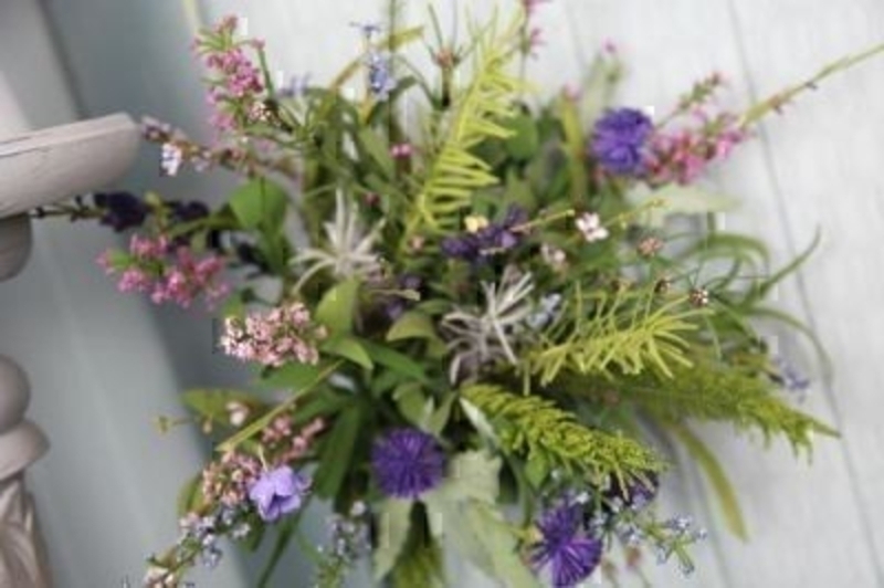 Bouquet of Thistle and Scottish Heathers by Bloomsbury. This quality bouquet of mixed artificial flowers of Scottish flowers such as heathers and thistles all tied off with black watch tartan ribbon. Size 50cm